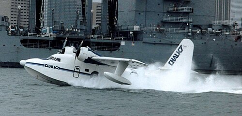 Seaplane over turquoise shallows