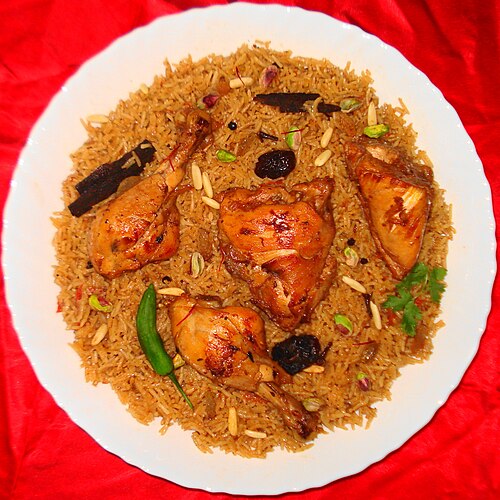 Kabsa served on a brass platter